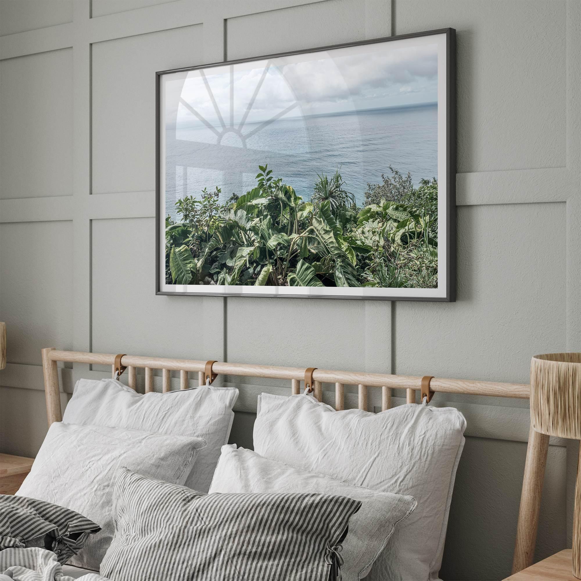 Tropical ocean view with lush green foliage overlooking the Pacific from Kauai, captured in fine art photography.