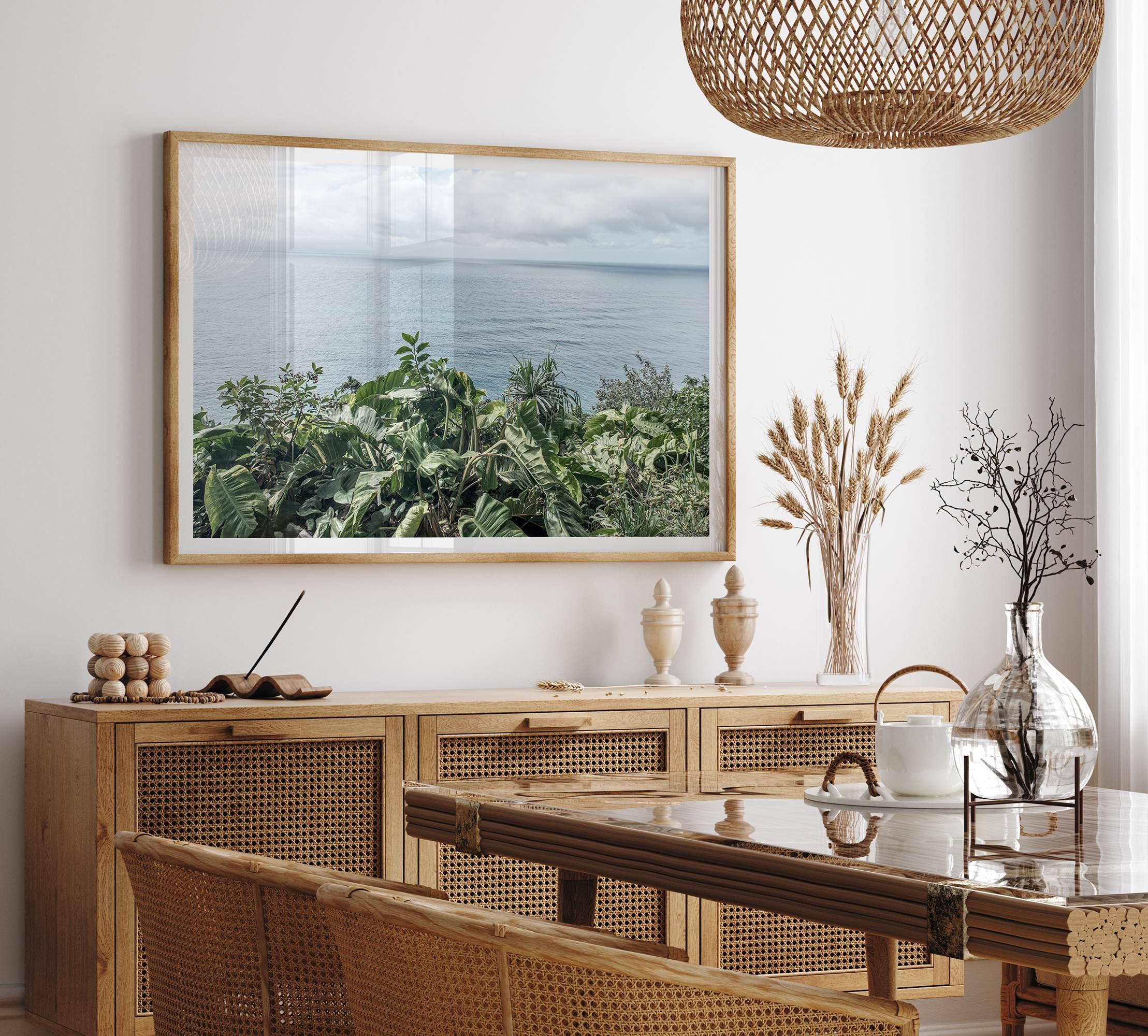 Tropical ocean view with lush green foliage overlooking the Pacific from Kauai, captured in fine art photography.