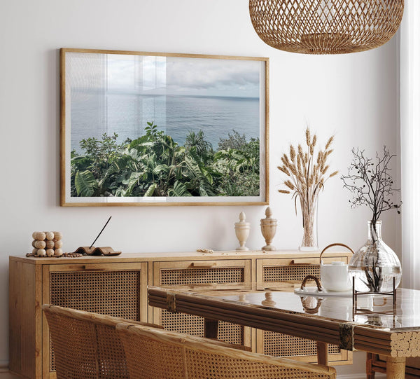 Tropical ocean view with lush green foliage overlooking the Pacific from Kauai, captured in fine art photography.