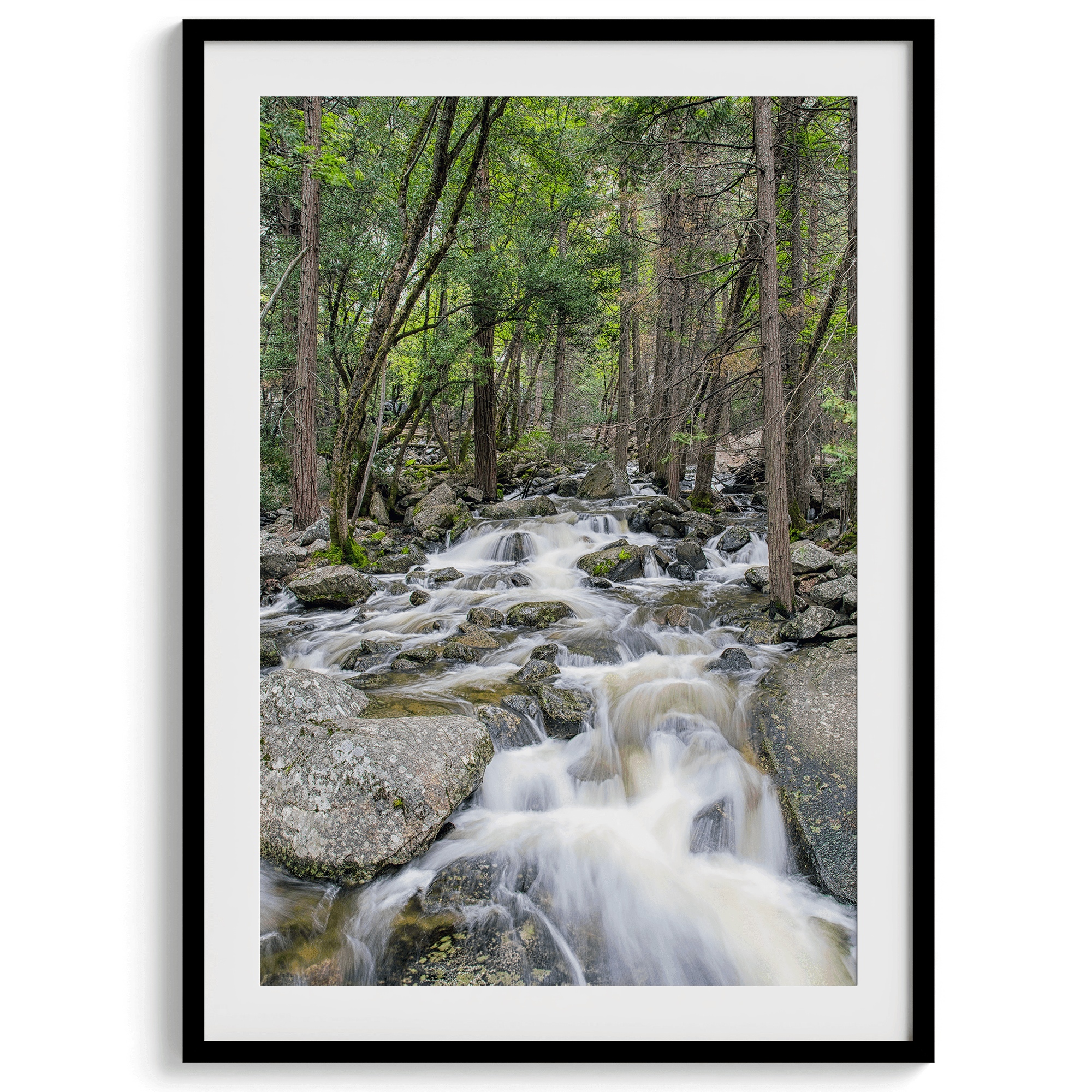 A beautiful river cuts through the forest, shot in long exposure making the water look creamy and calm in this fine art Yosemite National Park print.