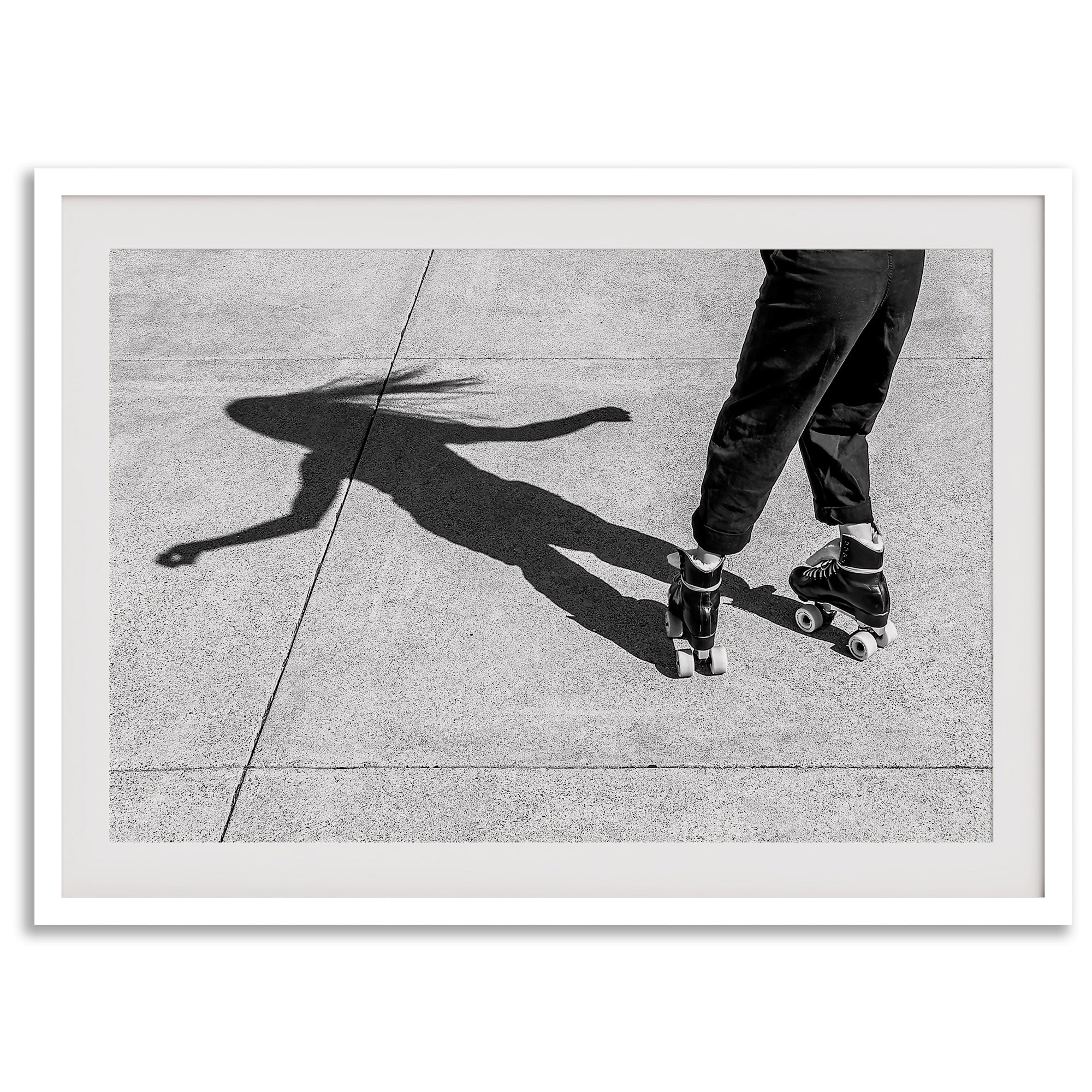 Black and white rollerskate photography taken in San Francisco during Fleet Week, showing a skater’s shadow on concrete, capturing minimalist urban style.