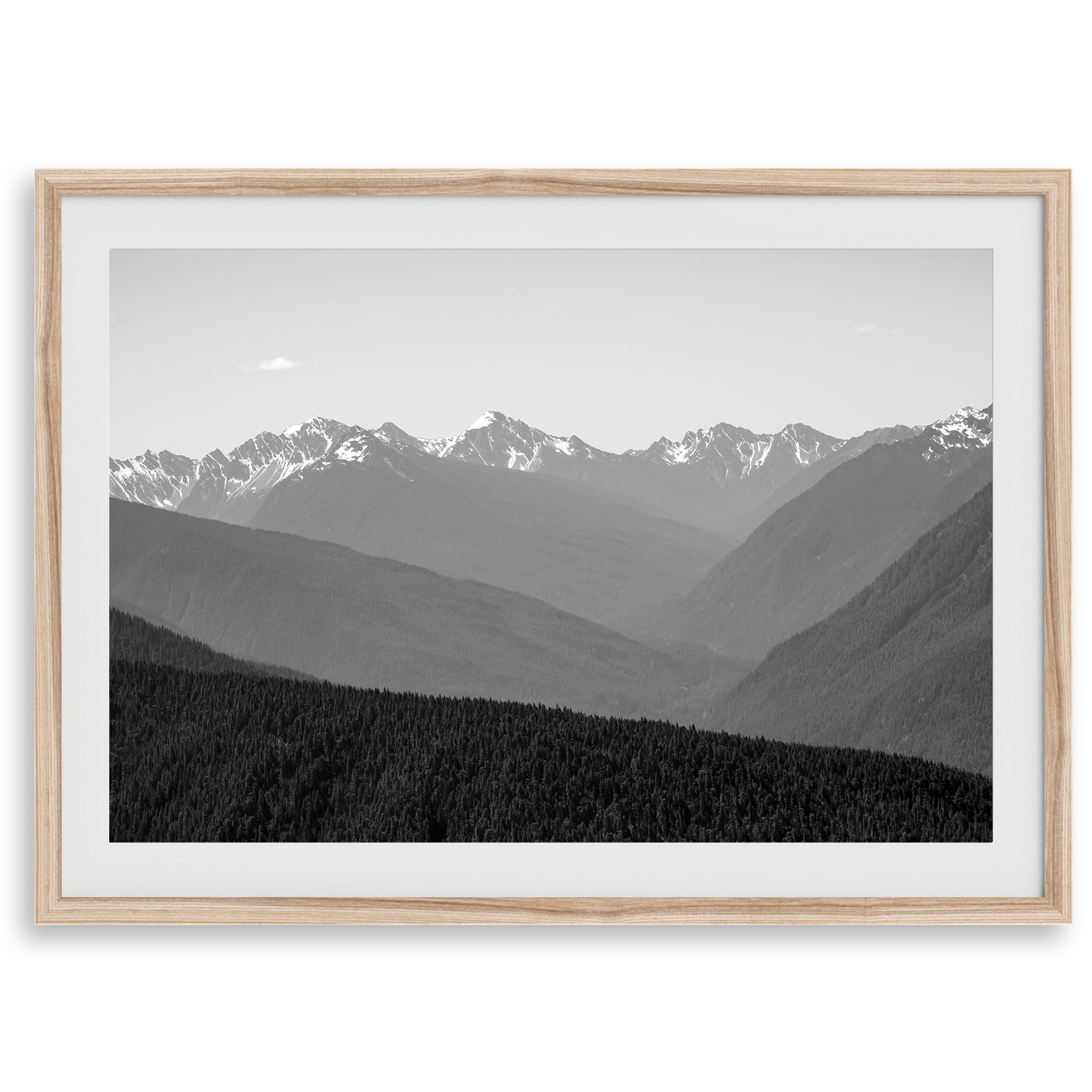 Black and white mountain photography wall art showcasing multiple layers of snowy mountain ranges. 