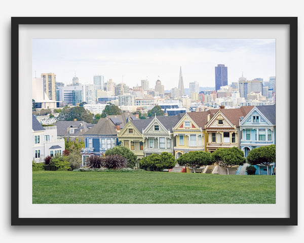 A fine art framed print of the famous colorful painted Ladies Victorian houses in Alamo Square, San Francisco.