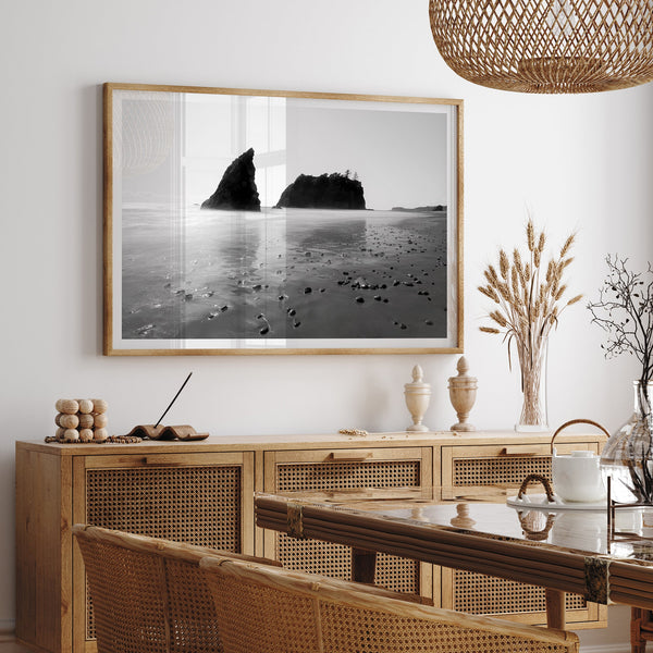 A fine art print of Ruby Beach in Olympic National Park, Washington. This black and white beach wall art features creamy waves in long exposure and dark-shaded towering rocks emerging from the ocean.