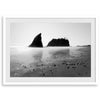 A fine art print of Ruby Beach in Olympic National Park, Washington. This black and white beach wall art features creamy waves in long exposure and dark-shaded towering rocks emerging from the ocean.