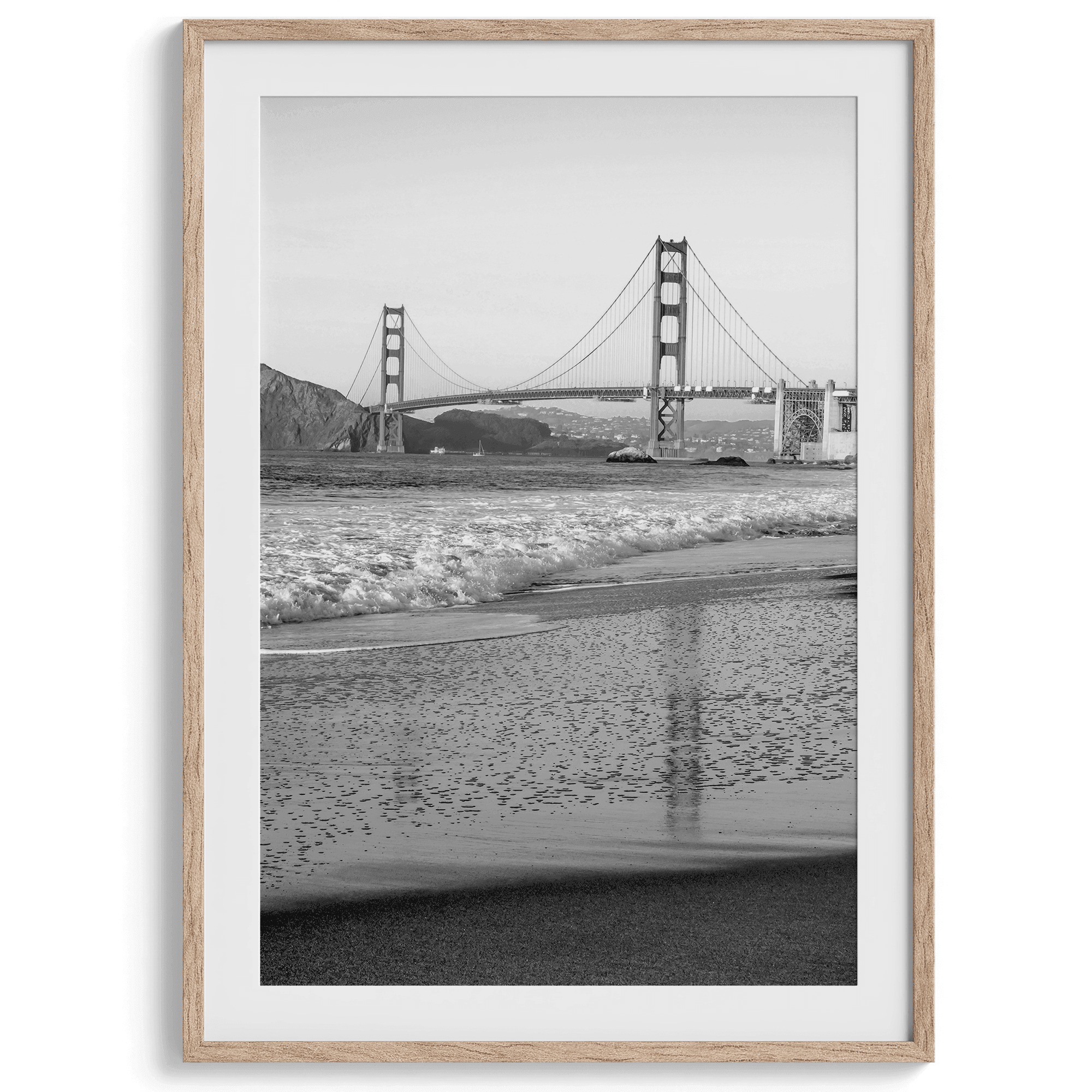 A fine art black and white print of the Golden Gate Bridge in San Francisco. This photo was taken from Baker Beach, showing the beautiful reflection of the bridge in the ocean. It is an excellent addition to your wall decor or a San Francisco gift.