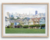 A fine art framed print of the famous colorful painted Ladies Victorian houses in Alamo Square, San Francisco.