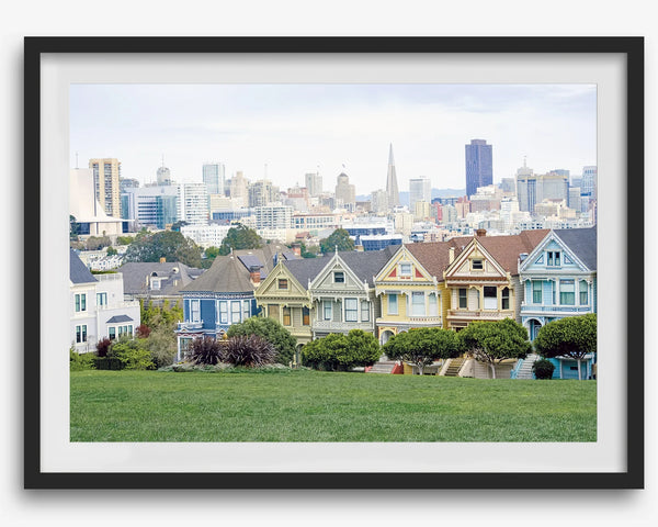 A fine art framed print of the famous colorful painted Ladies Victorian houses in Alamo Square, San Francisco.