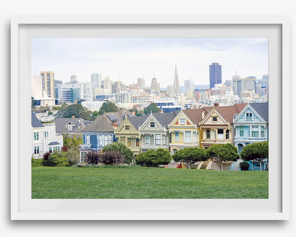 A fine art framed print of the famous colorful painted Ladies Victorian houses in Alamo Square, San Francisco.
