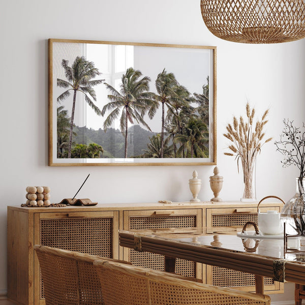 Tropical beach palm tree art with lush green palms against a misty hillside in coastal landscape