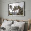 Tropical beach palm tree art with lush green palms against a misty hillside in coastal landscape