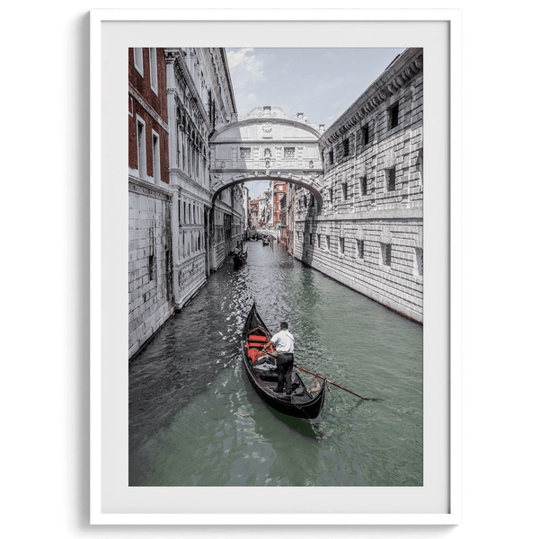 A fine art Venice travel print framed or unframed poster showcasing a Goldola sailing in one of the narrow canals of the old cities of Italy.