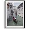 A fine art Venice travel print framed or unframed poster showcasing a Goldola sailing in one of the narrow canals of the old cities of Italy.