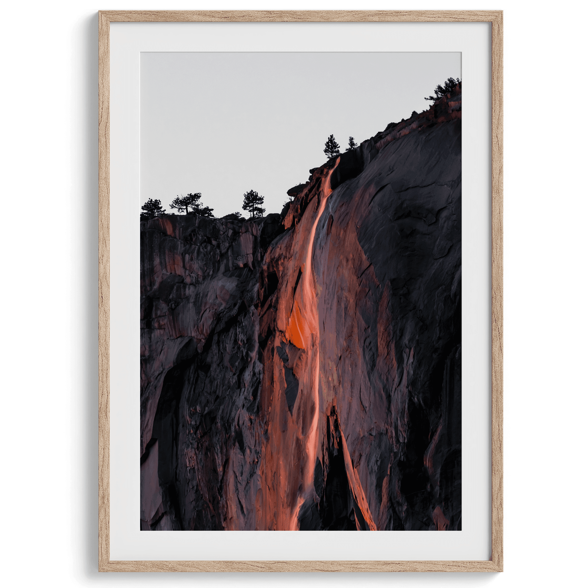 This premium photography framed or unframed fine poster print of Yosemite National Park Firefall - a rare phenomenon where Horsetail Falls in Yosemite seems to be flowing with fire rather than water.