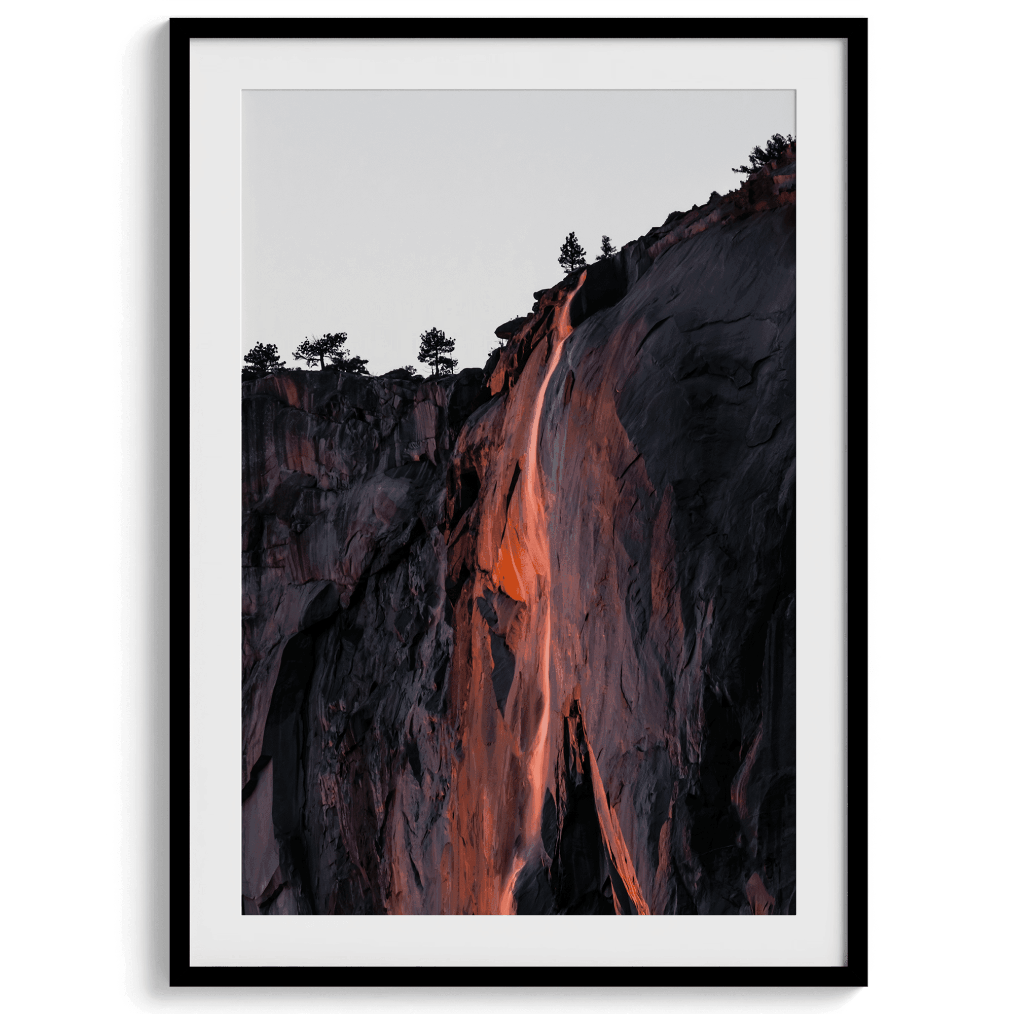 This premium photography framed or unframed fine poster print of Yosemite National Park Firefall - a rare phenomenon where Horsetail Falls in Yosemite seems to be flowing with fire rather than water.