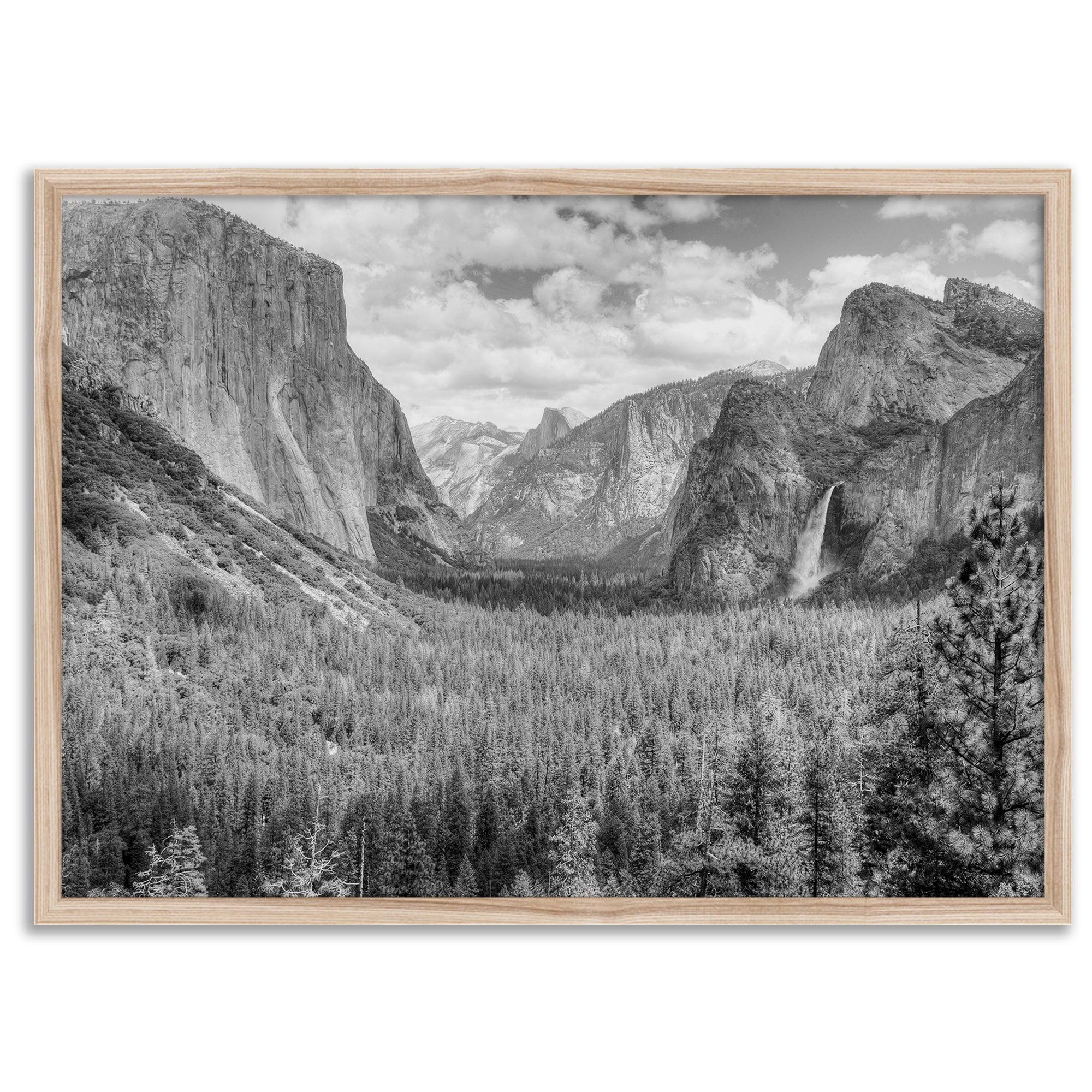 A breathtaking fine art black and white print of Yosemite valley during spring when the waterfalls are in full power.