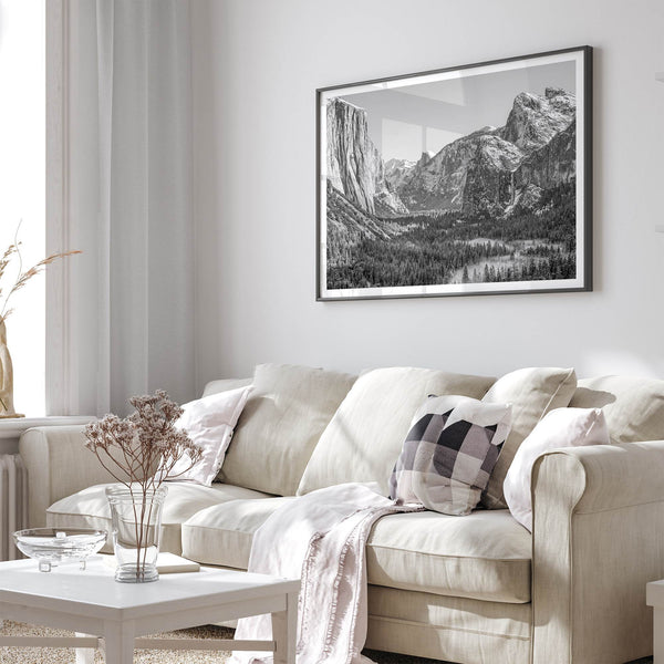 A fine art Yosemite Print featuring Yosemite Valley covered in snow in winter and a beautiful fog lays in the valley forest. This black and white mountain wall art is perfect for nature and fine art lovers.