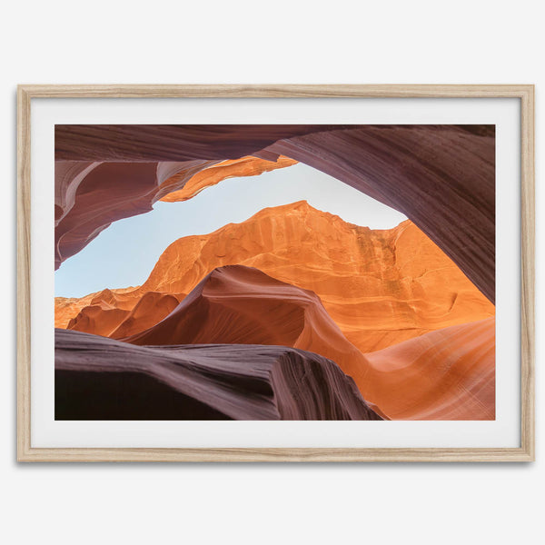 Framed fine art print of Antelope Canyon in Arizona, showcasing layered desert rock formations with rich colors and smooth textures.