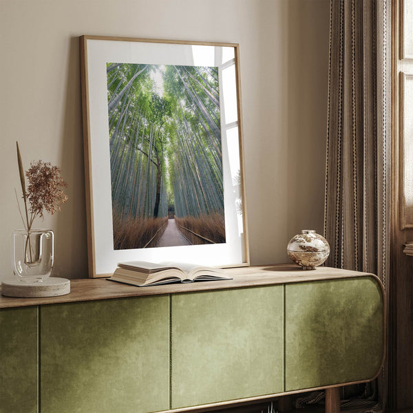 Vertical bamboo forest photograph from Arashiyama, tranquil path and glowing greens, premium bamboo wall art