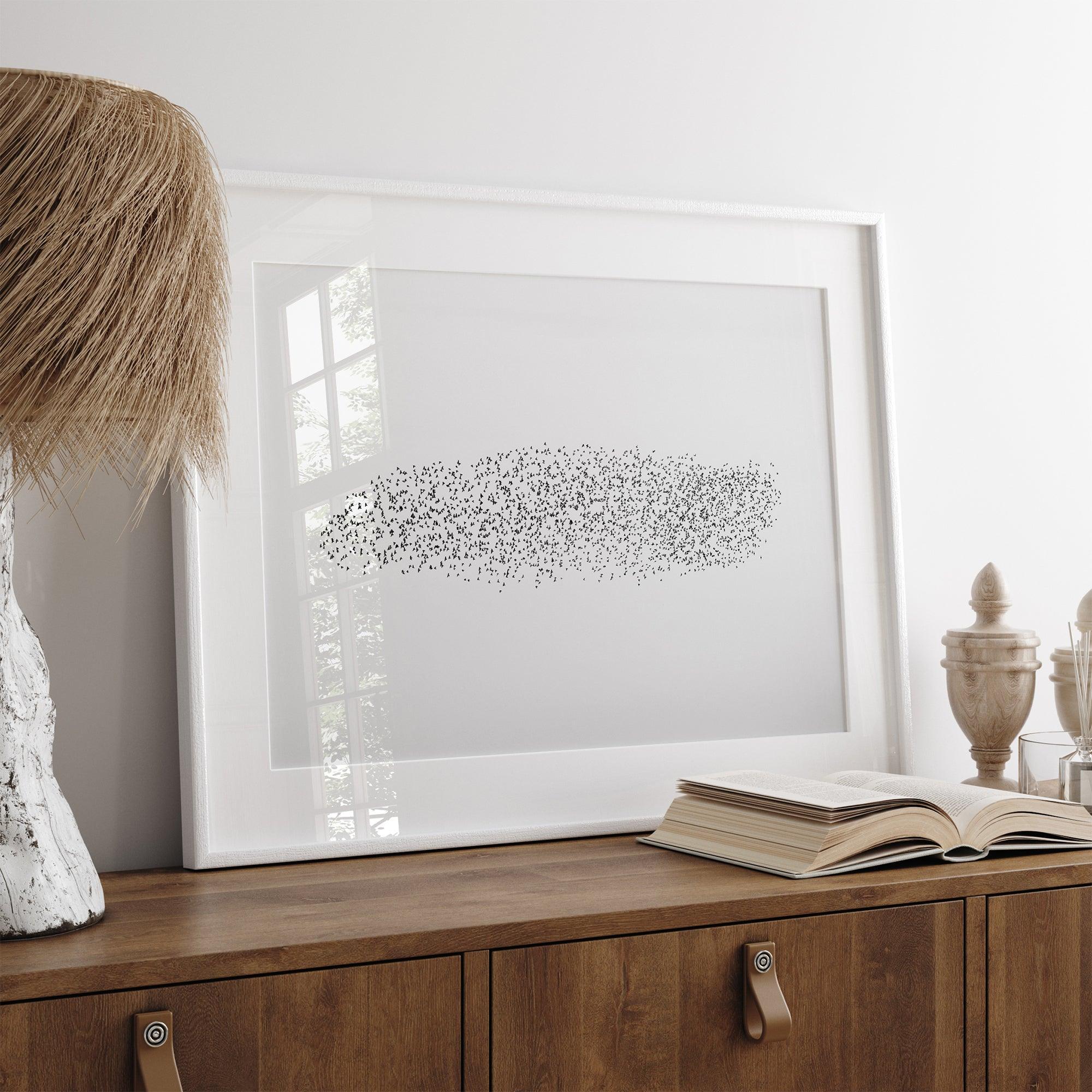 Black and white nature photography landscape of a starling murmuration in flight.