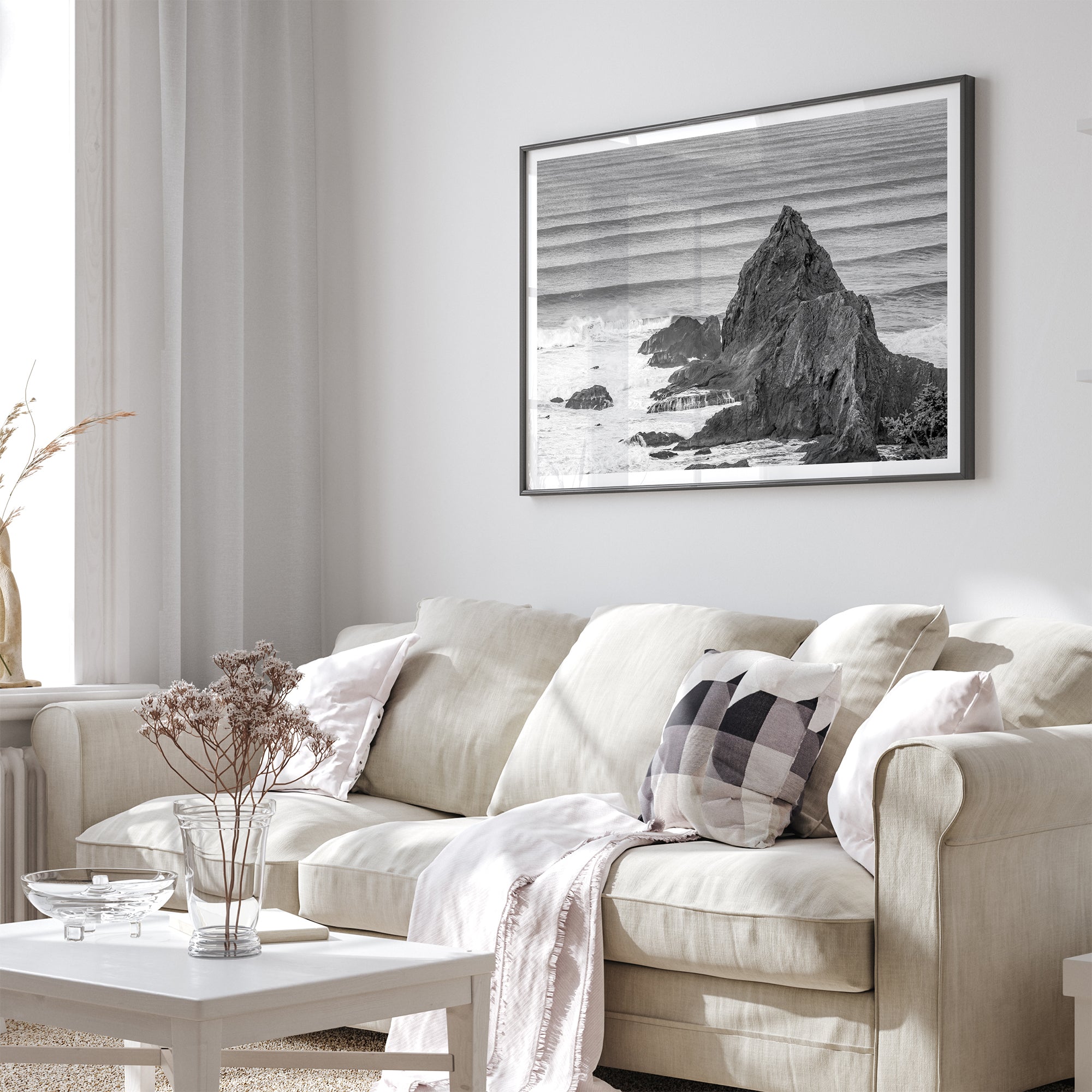 Black and white seascape wall art featuring minimalist  ocean waves and rugged coastal rock formations