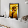 Silhouetted cactus against a vibrant yellow sunset in Joshua Tree National Park, capturing desert beauty.