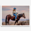 Cowgirl on horseback at sunset in desert landscape – rustic western wall decor print