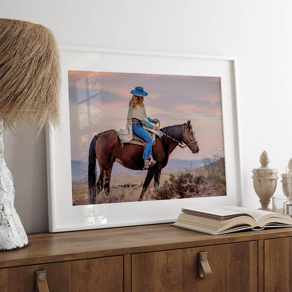 Cowgirl on horseback at sunset in desert landscape – rustic western wall decor print