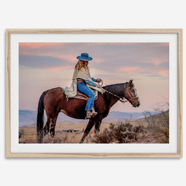 Cowgirl on horseback at sunset in desert landscape – rustic western wall decor print