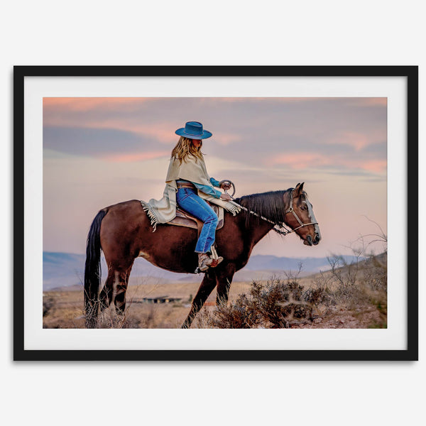 Cowgirl on horseback at sunset in desert landscape – rustic western wall decor print