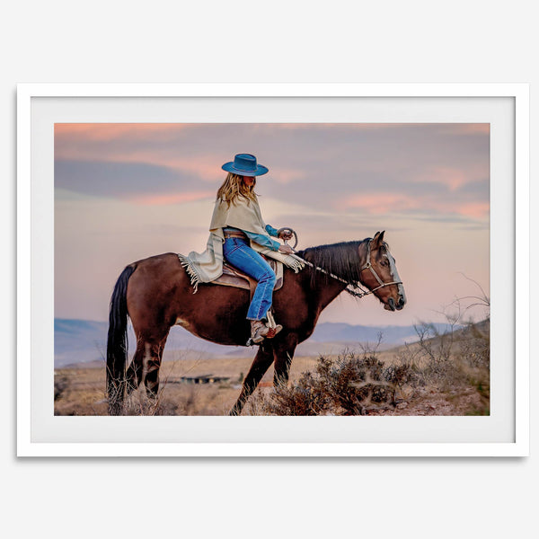 Cowgirl on horseback at sunset in desert landscape – rustic western wall decor print