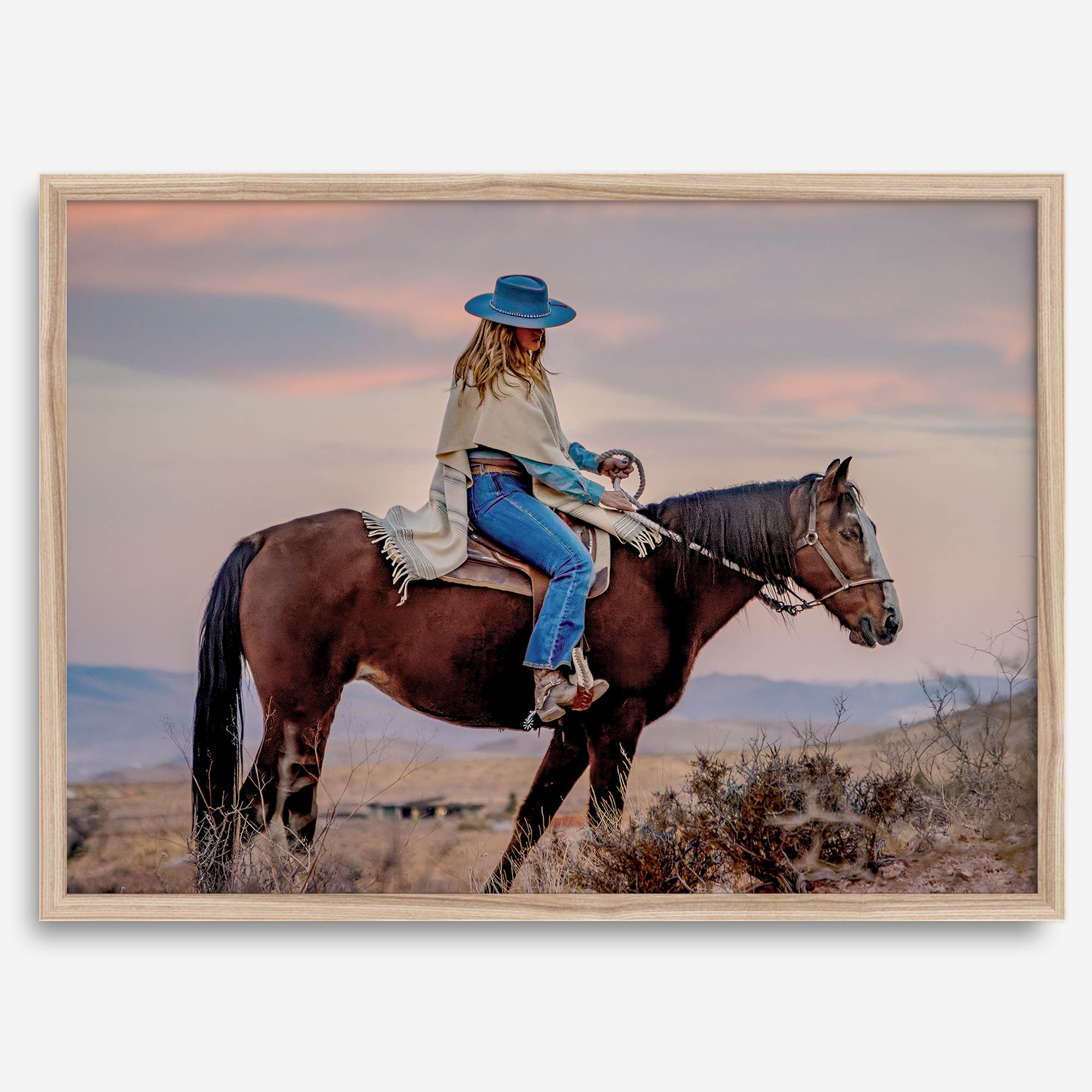Cowgirl on horseback at sunset in desert landscape – rustic western wall decor print