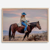 Cowgirl on horseback at sunset in desert landscape – rustic western wall decor print