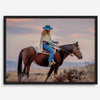 Cowgirl on horseback at sunset in desert landscape – rustic western wall decor print