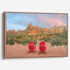 Framed or stretched canvas print of two red chairs facing desert mountains at sunset in Sedona, Arizona – fine art landscape