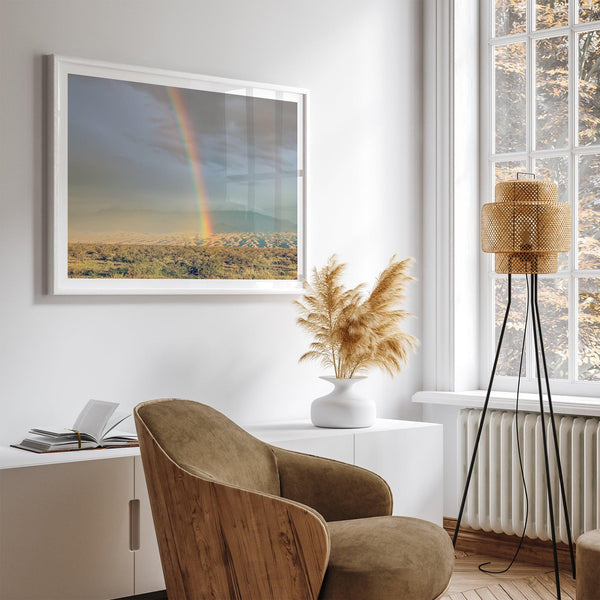 Desert landscape artwork of a rainbow over Arizona sand dunes with distant mountains