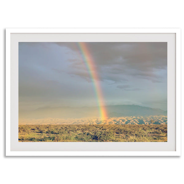 Desert landscape artwork of a rainbow over Arizona sand dunes with distant mountains