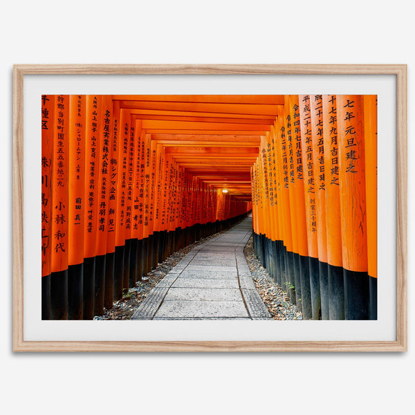 Framed photograph of the Fushimi Inari Torii Gates in Kyoto, Japan, showcasing vibrant vermilion gates.