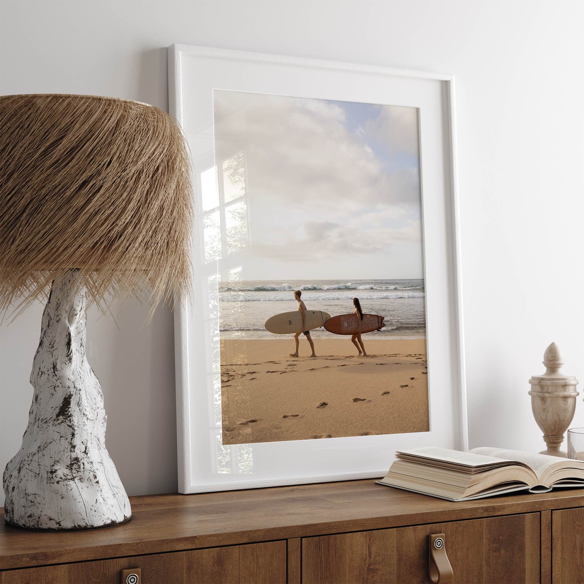 Framed surfers on beach art print featuring Hawaiian coastline and calm morning tones