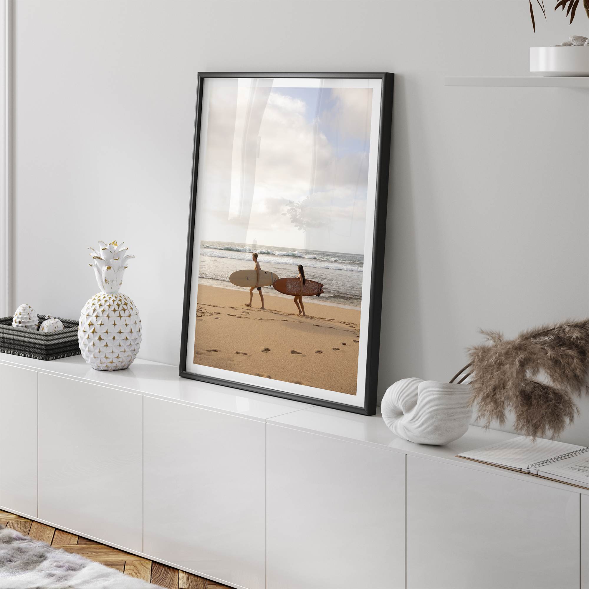 Framed surfers on beach art print featuring Hawaiian coastline and calm morning tones