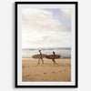 Framed surfers on beach art print featuring Hawaiian coastline and calm morning tones