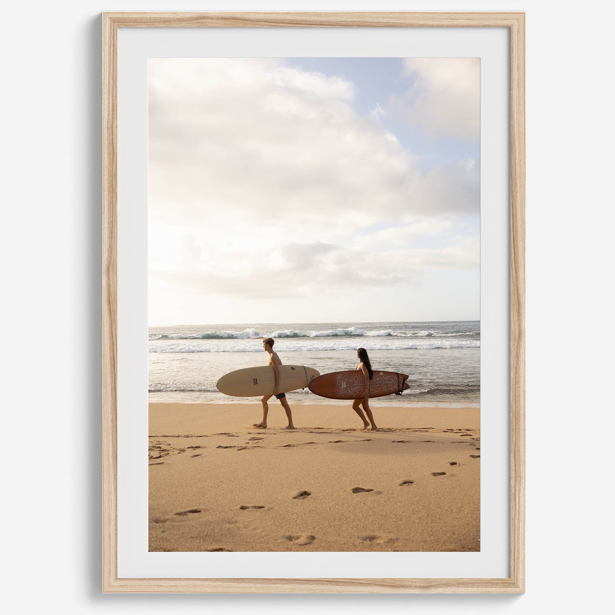 Framed surfers on beach art print featuring Hawaiian coastline and calm morning tones