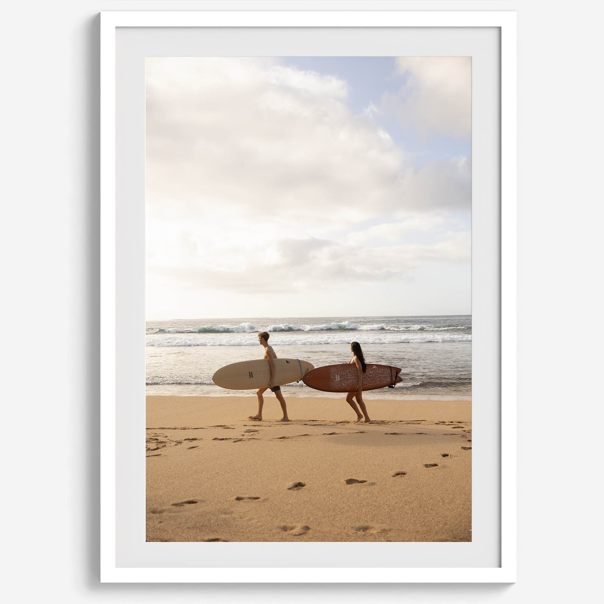 Framed surfers on beach art print featuring Hawaiian coastline and calm morning tones