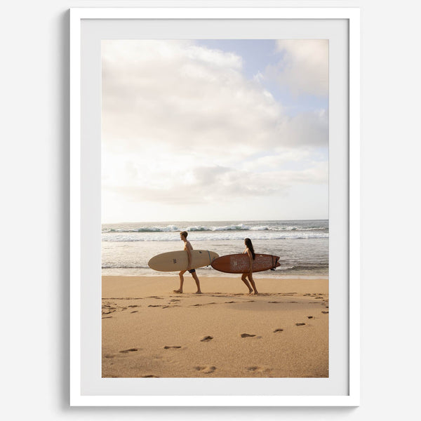 Framed surfers on beach art print featuring Hawaiian coastline and calm morning tones