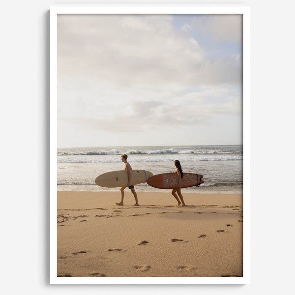 Framed surfers on beach art print featuring Hawaiian coastline and calm morning tones