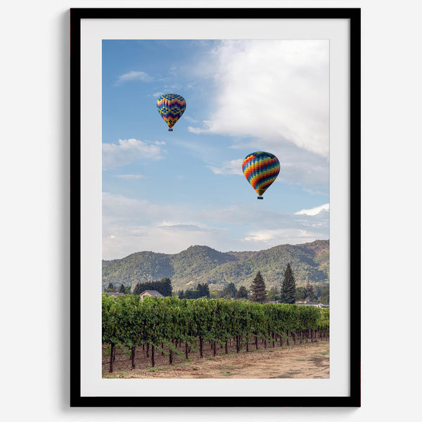 Fine art hot air balloon photography print above Napa Valley vineyards in Yountville.