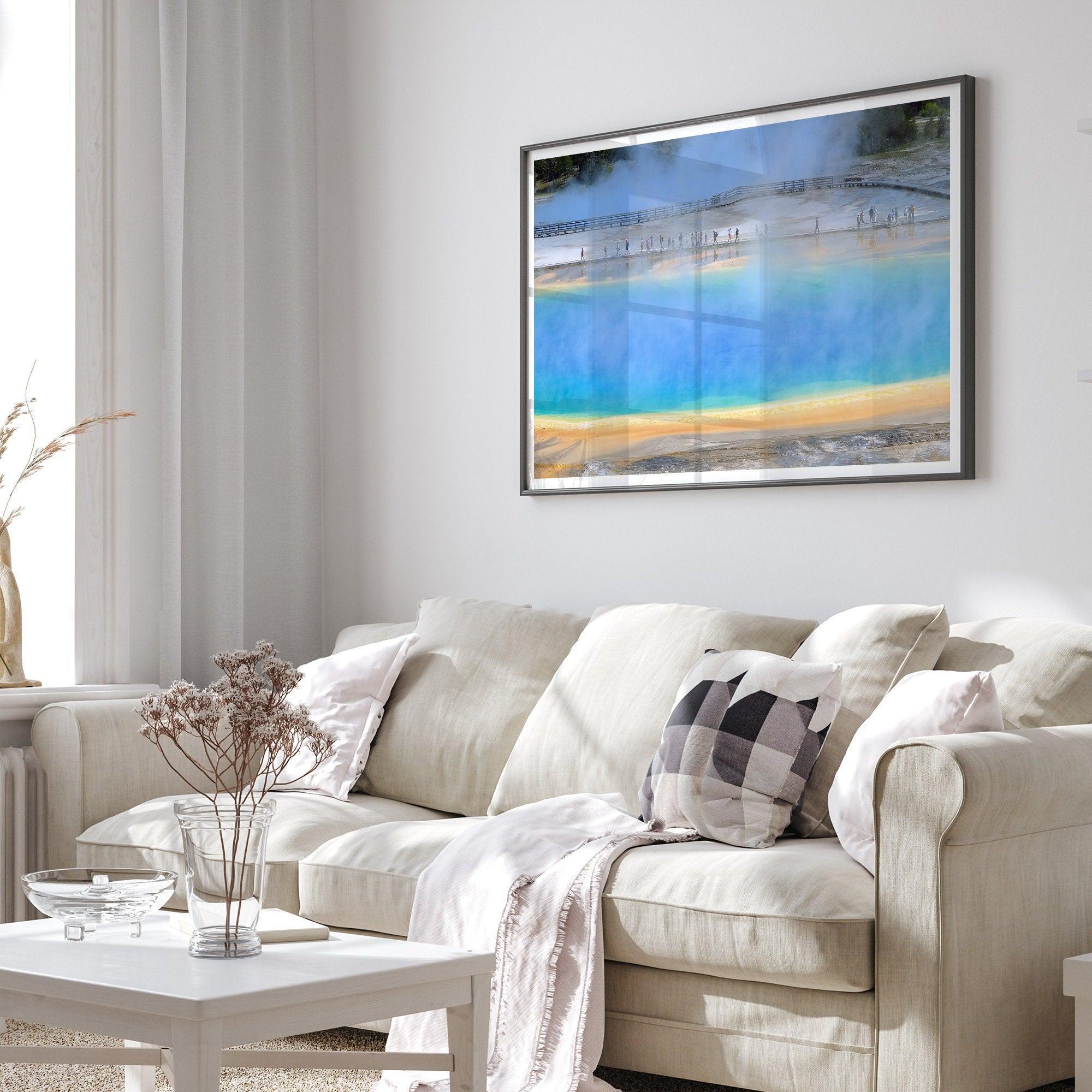 A fine art colorful photography print of Grand Prismatic Hot Springs in Yellowstone National Park. The picture shows the scale of the hot springs next to the people walking next to it.