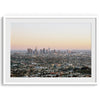 Los Angeles cityscape bathed in a vibrant sunset, showcasing the city&#39;s iconic buildings from above