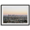 Los Angeles cityscape bathed in a vibrant sunset, showcasing the city&#39;s iconic buildings from above