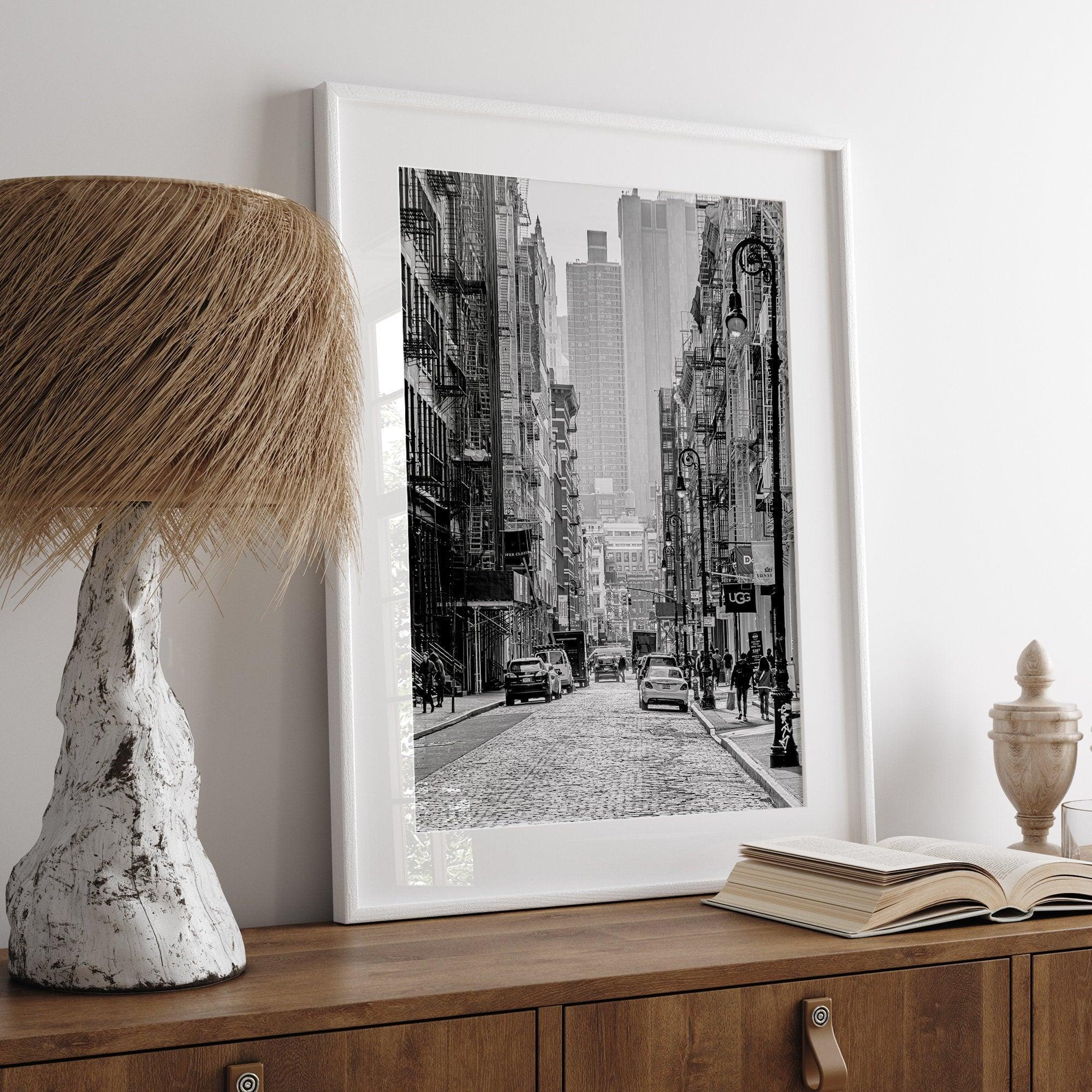 A fine art vertical photography print of a bustling NYC street with unique NYC architecture and fire escape stairs.